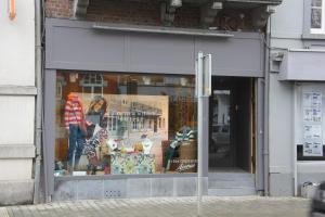 a store window of a store with a mannequin in it at Lola des Sources in Spa