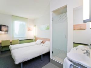 Posteľ alebo postele v izbe v ubytovaní ibis budget Torun
