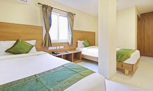 Letto o letti in una camera di Itsy Hotels Jansi Residency