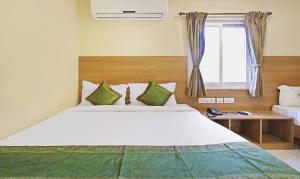 Letto o letti in una camera di Itsy Hotels Jansi Residency