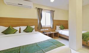 Letto o letti in una camera di Itsy Hotels Jansi Residency