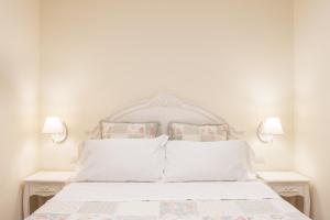 Postel nebo postele na pokoji v ubytování Dimora Sant'Orsola