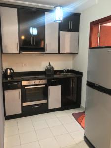 A kitchen or kitchenette at Pool View One bedroom Apt - B103