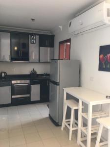 A kitchen or kitchenette at Pool View One bedroom Apt - B103