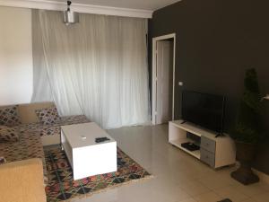A television and/or entertainment centre at Pool View One bedroom Apt - B103