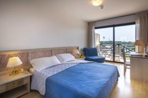 Postel nebo postele na pokoji v ubytování Hotel Marina Uno + 37 fotografií