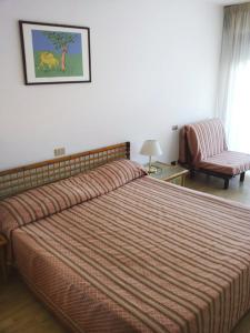 Postel nebo postele na pokoji v ubytování Hotel Marina Uno