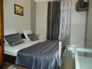 Postel nebo postele na pokoji v ubytování Guest House R&T