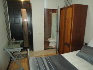 Postel nebo postele na pokoji v ubytování Guest House R&T