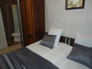 Postel nebo postele na pokoji v ubytování Guest House R&T