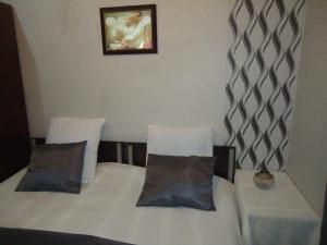 Postel nebo postele na pokoji v ubytování Guest House R&T