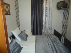 Postel nebo postele na pokoji v ubytování Guest House R&T
