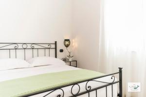 Łóżko lub łóżka w pokoju w obiekcie B&B Palazzo Pinto 2