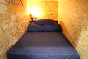 Postel nebo postele na pokoji v ubytování Fuji Guest House Ao