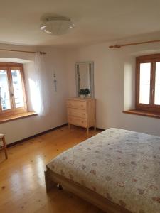 Posteľ alebo postele v izbe v ubytovaní Appartamento Comelico Dolomiti
