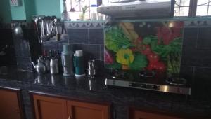 a kitchen counter with a bunch of vegetables on it at Sanjeema Homestay in Kurseong