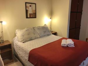 
A bed or beds in a room at El Retorno Hostel
