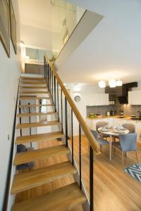 a staircase leading to the kitchen and dining room in a house at Relax Birstonas in Birštonas
