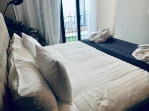 Posteľ alebo postele v izbe v ubytovaní Terreno Suites