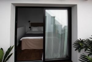 Posteľ alebo postele v izbe v ubytovaní Terreno Suites