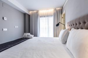 Posteľ alebo postele v izbe v ubytovaní Terreno Suites