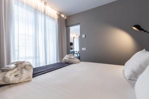 Posteľ alebo postele v izbe v ubytovaní Terreno Suites