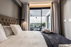 Posteľ alebo postele v izbe v ubytovaní Terreno Suites + 37 fotografií