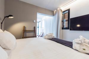 Posteľ alebo postele v izbe v ubytovaní Terreno Suites