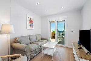 Televízia a/alebo spoločenská miestnosť v ubytovaní PENTHOUSE CABO ROIG - ALDEAS I