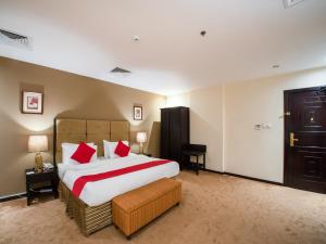 Łóżko lub łóżka w pokoju w obiekcie Eastward Hotel