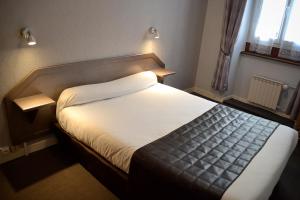 Postel nebo postele na pokoji v ubytování Hotel Angleterre