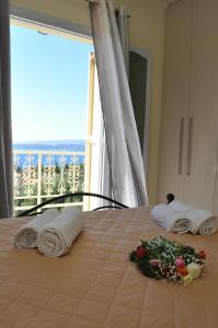 A bed or beds in a room at Polymnia Apartments Lassi