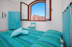 מיטה או מיטות בחדר ב-Quadrilocale Laura