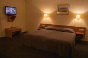 Cama o camas de una habitación en Hotel 't Zwaantje