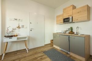 Kuchyň nebo kuchyňský kout v ubytování 2Bfree Apartments