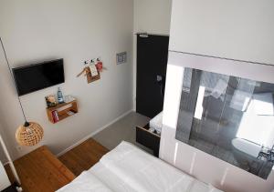 Postel nebo postele na pokoji v ubytování Michelberger Hotel