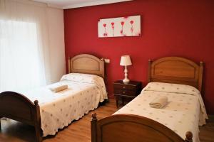 Postel nebo postele na pokoji v ubytování Albergue El Puntido