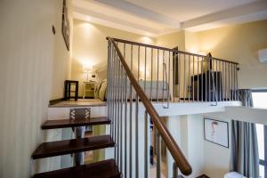 a staircase leading to a bedroom in a house at Art & Jazz Hotel in Catania