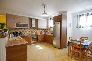 Kuchyň nebo kuchyňský kout v ubytování Anemona Apartment