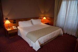 Postel nebo postele na pokoji v ubytování Air Palace Hotel