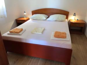 Postel nebo postele na pokoji v ubytování Apartments Nautic
