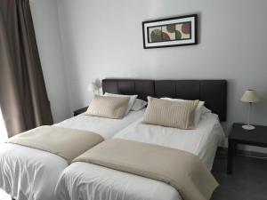 Postel nebo postele na pokoji v ubytování Apartamentos El Patio + 37 fotografií
