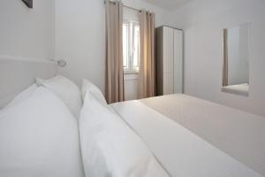 Cama ou camas em um quarto em Apartments Nina