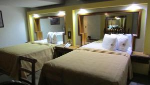 Voodi või voodid majutusasutuse Hotel Mina toas