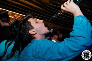 a man is drinking water from a bottle at Greg&Tom Beer House Hostel in Krakow