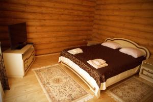 Postel nebo postele na pokoji v ubytování Oasis Karpat