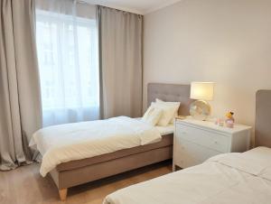 Łóżko lub łóżka w pokoju w obiekcie Two-bedroom apartment 'Taupé'