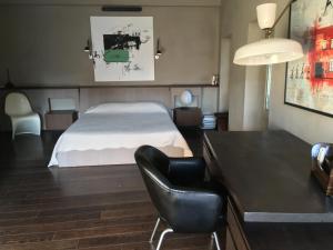 Кровать или кровати в номере La Loge de mer, Lodge urbain