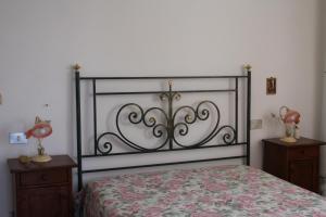 Ένα ή περισσότερα κρεβάτια σε δωμάτιο στο Dimora Doname