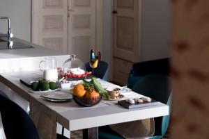 a table with fruits and vegetables on top of it at 206 Via Roma in Linguaglossa